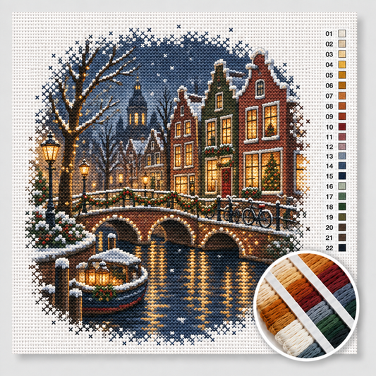 Kerst kruissteek pakket — Amsterdamse gracht bij avond met kerstlichtjes over de brug en besneeuwde grachtenpanden
