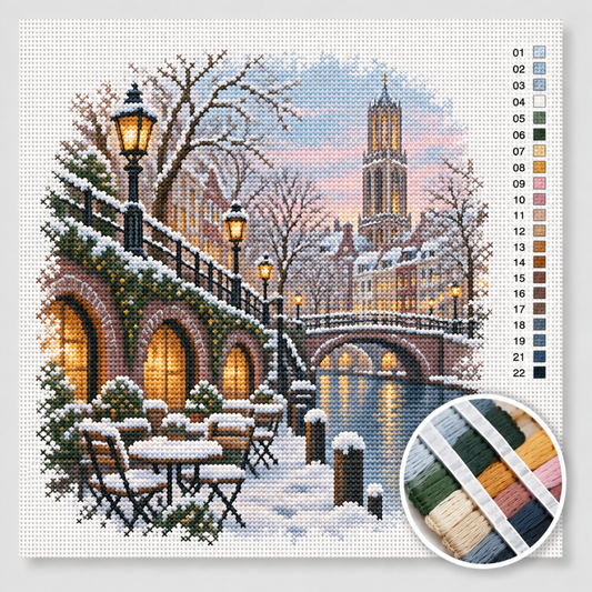 Winter kruissteek pakket — besneeuwde werf aan de Oudegracht in Utrecht met verlichte werfkelders en Domtoren