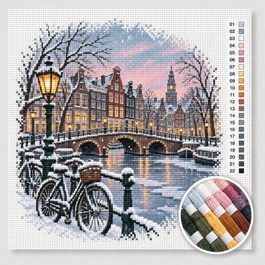 Winter kruissteek pakket — besneeuwde Amsterdamse gracht met grachtenpanden en verlichte brug